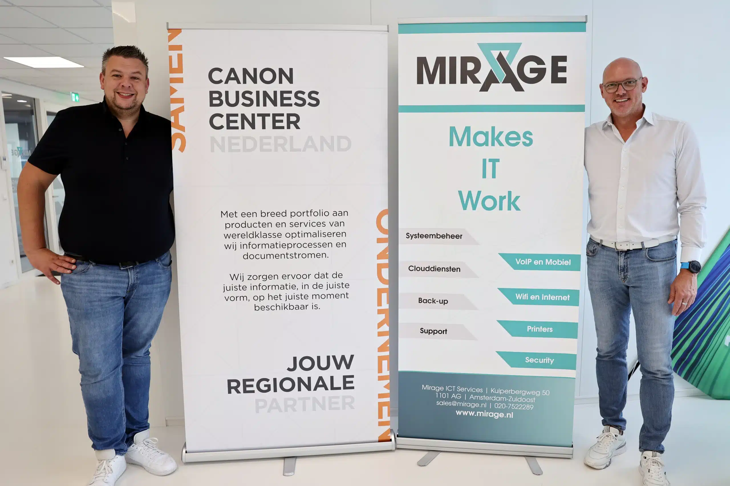 Twee personen bij banners van Canon Business Center Nederland en Mirage ICT-Services